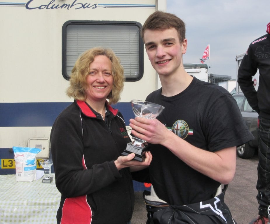 Tom Hill receives his trophy from Heather Green after race 1