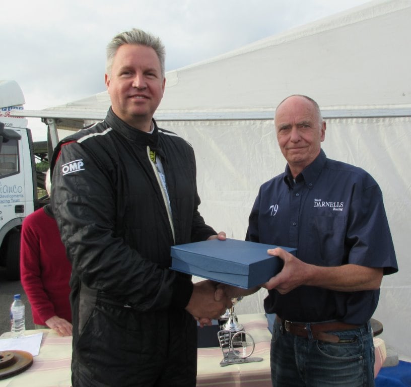 Simon Cresswell receives his trophy for 2nd in TS on Saturday from Brian Messenger.