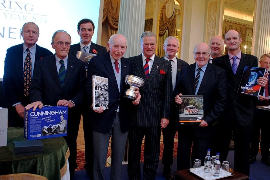 Richard Harman at the Royal Automobile Club’s presentation party In October 2014 with that year’s winner John Surtees holding the Trophy.